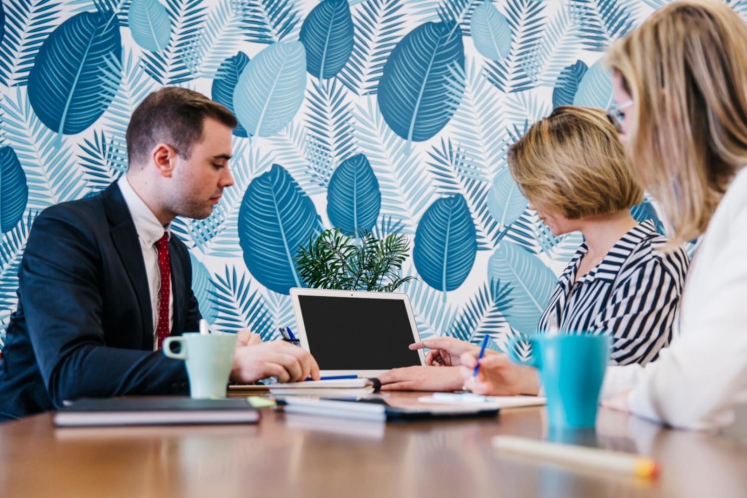 Students working on financial analysis in collaborative learning environment